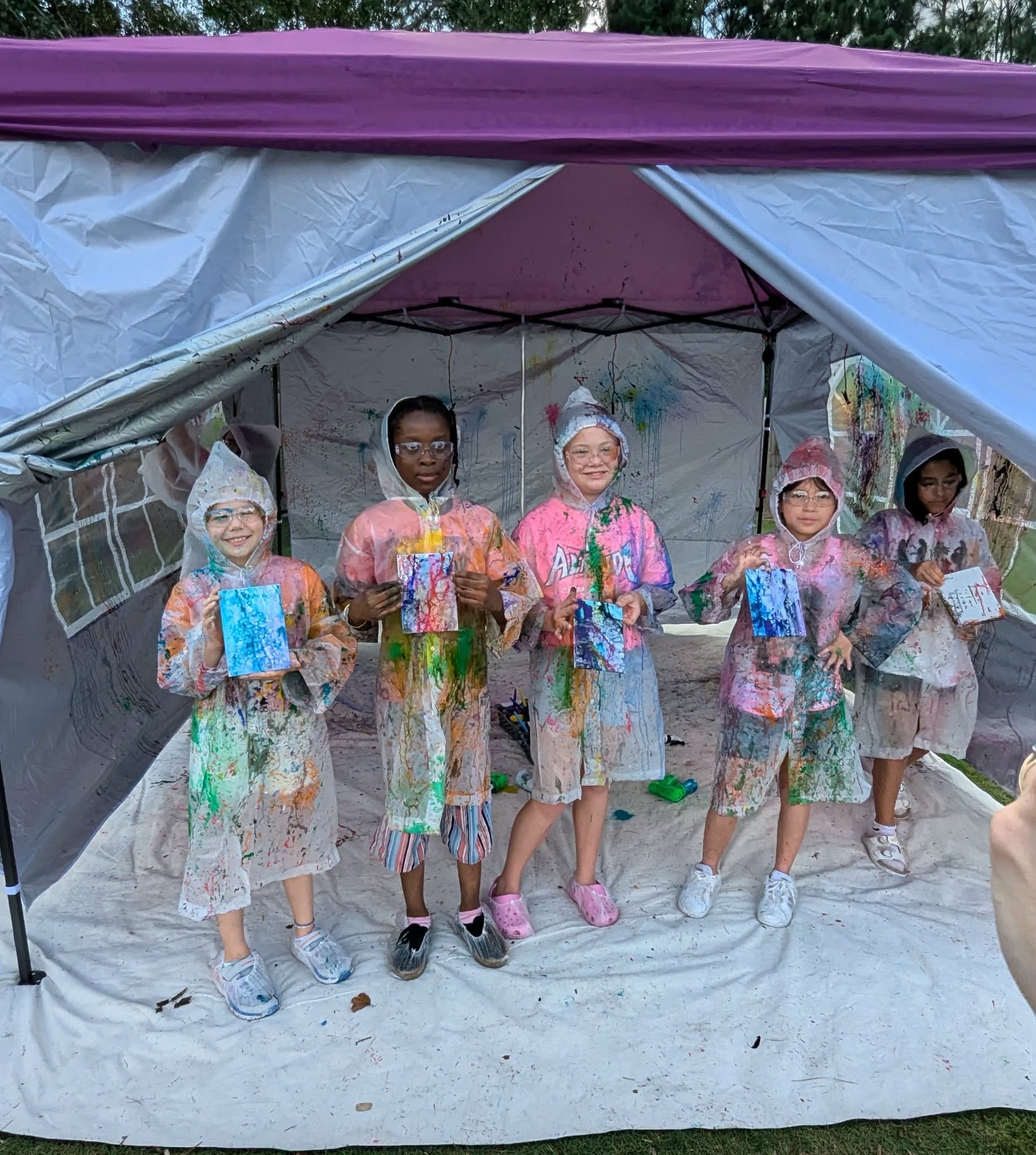 Children enjoying a SIS splatter paint party