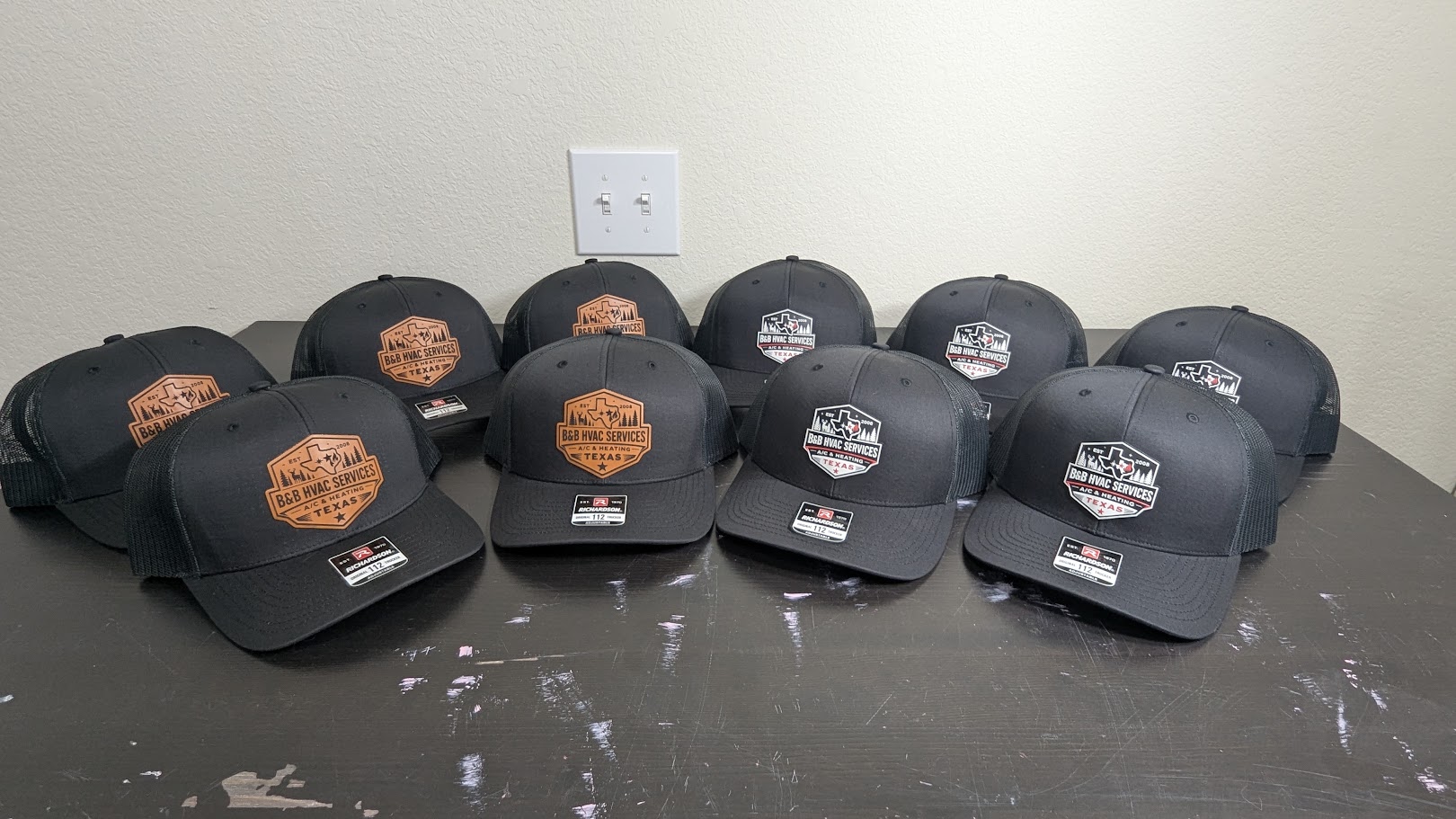Large group of custom B and B HVAC Services hats